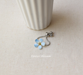 Forget-Me-Not finger ring with slider chain